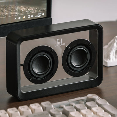 Black See-Through Speaker on desktop