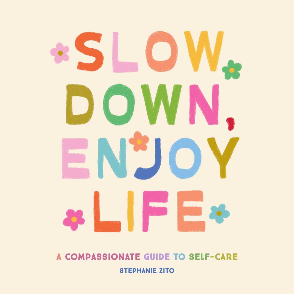 Book cover with colorful text 'Slow Down, Enjoy Life' on a beige background