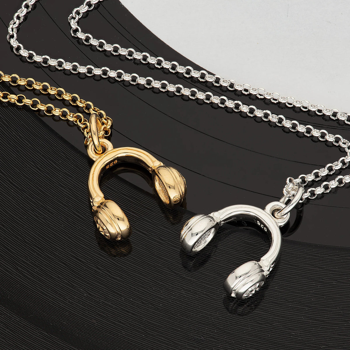 Gold and Silver headphones necklace lifestyle shot.