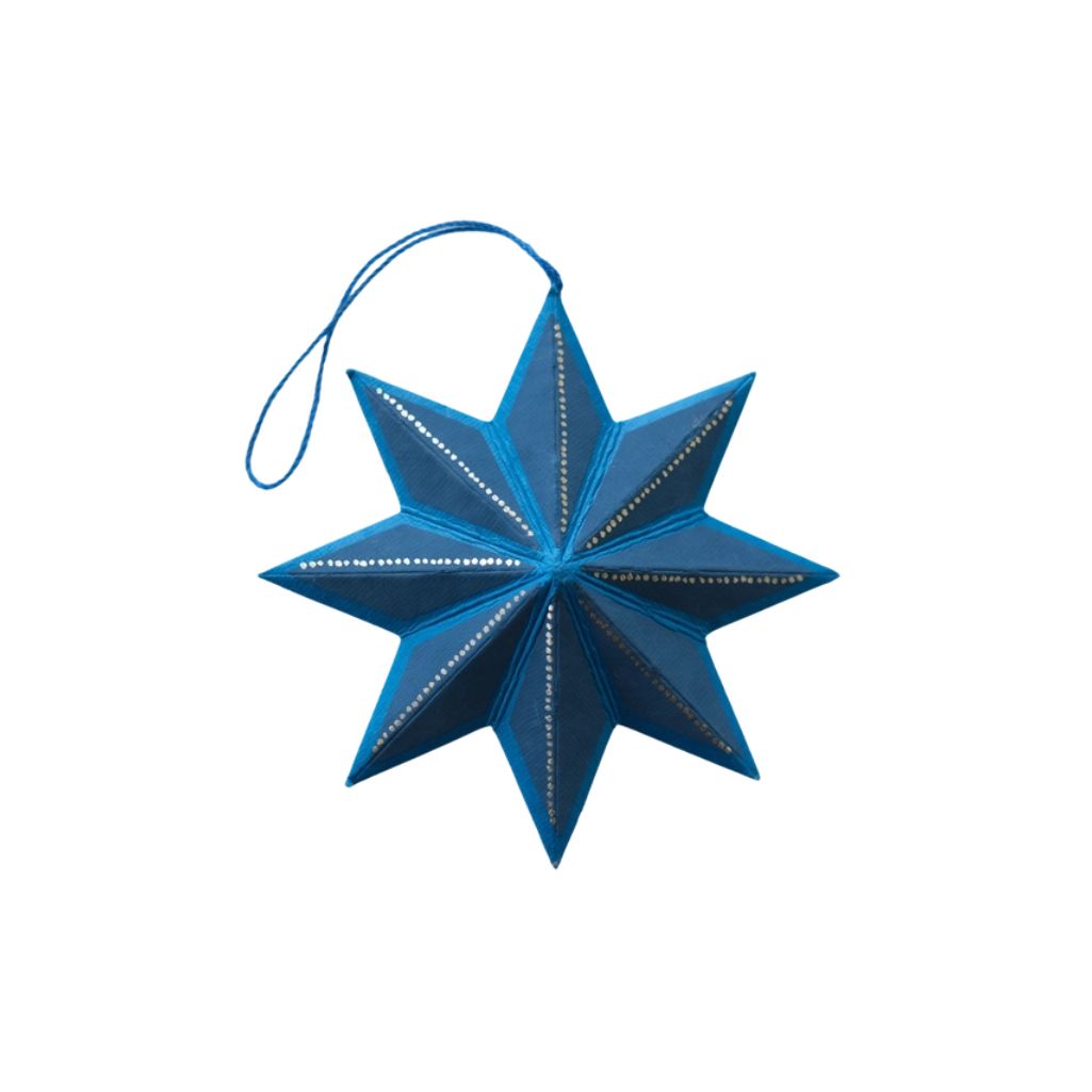 Blue star-shaped ornament on a white background