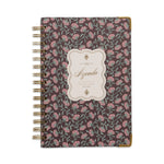 Floral patterned notebook with 'Agenda' label on a white background