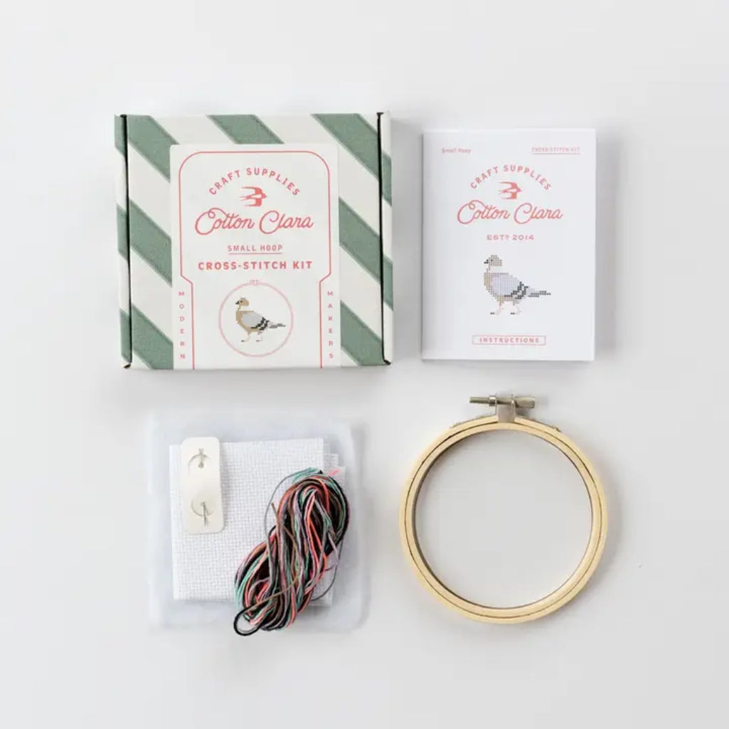 Cross-stitch kit with 'Cotton Clara' packaging on a white background