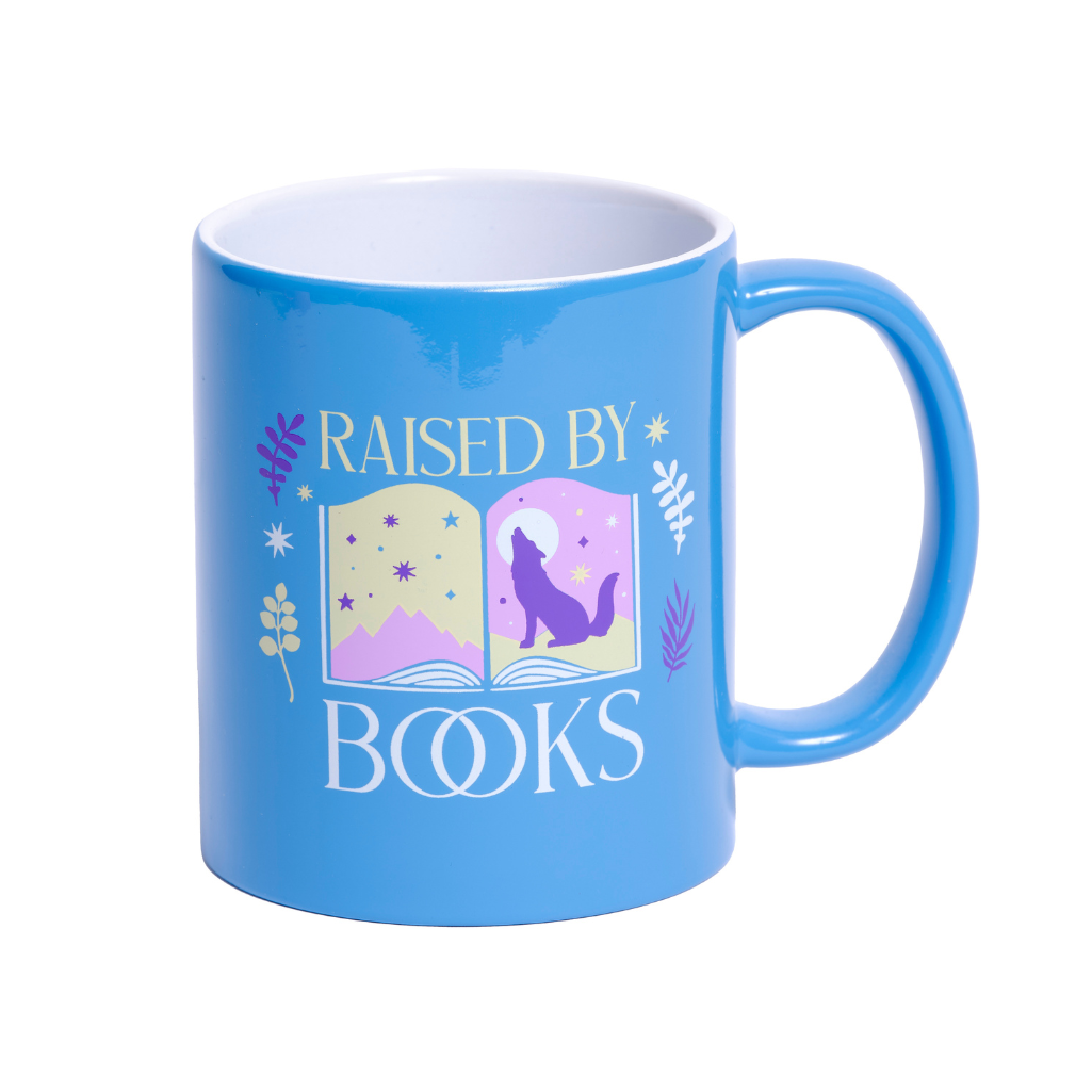 Printed in a dreamer's sky-blue, this ceramic mug features an open book depicting an enchanting scene: twilight mountains, glimmering stars, and a lone wolf howling at a storybook moon. Botanicals frame the scene, adding a touch of fairytale whimsy. The phrase "Raised by Books" is elegantly printed in a mix of golden and white typography. 