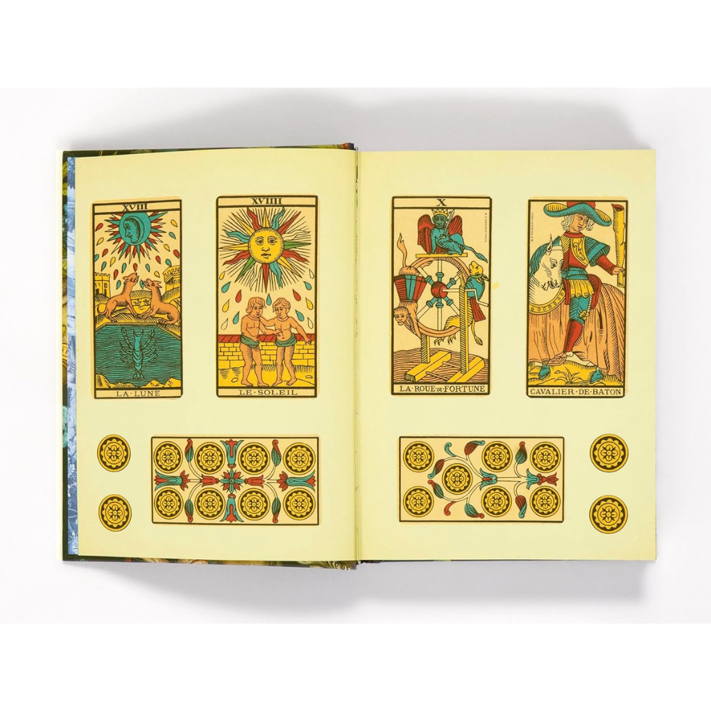 Open book displaying tarot card illustrations on a white background