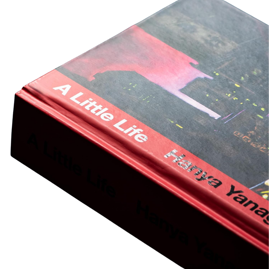 Book titled 'A Little Life' by Hanya Yanagihara with a red spine.