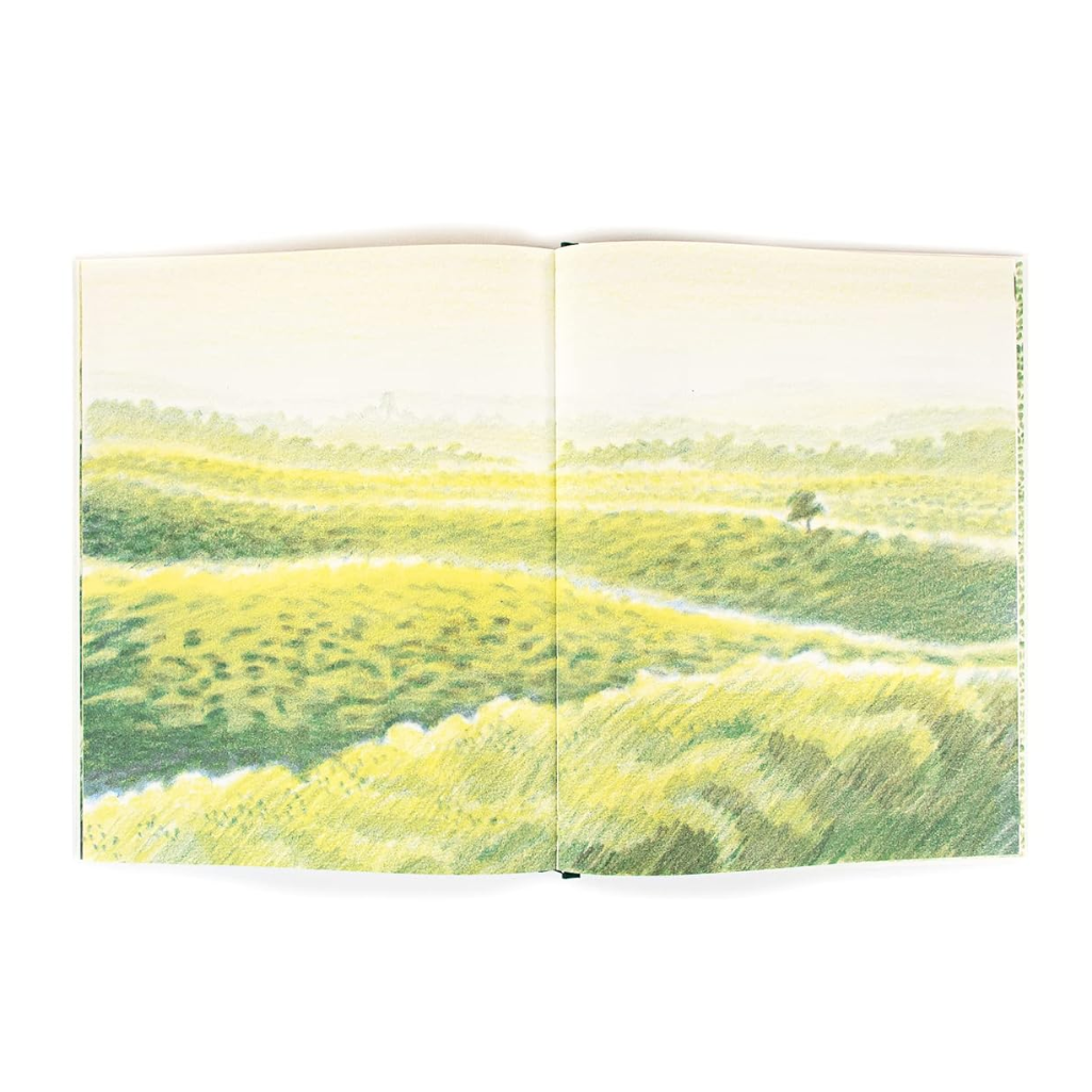Open book with a landscape illustration of green fields and a tree on a white background