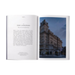 Open book with text and a photograph of The Langham hotel at night.