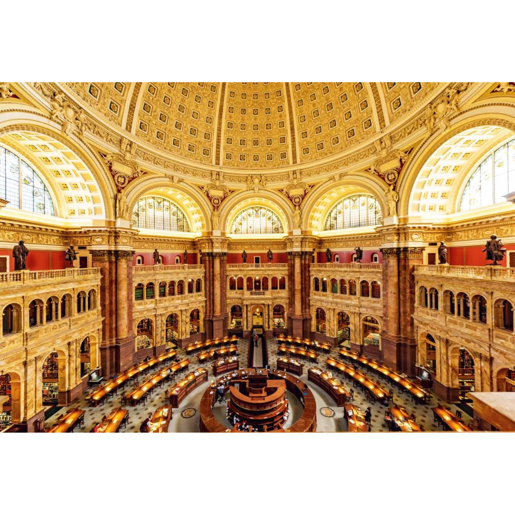 Large, ornate interior of a building with high ceilings and large windows.