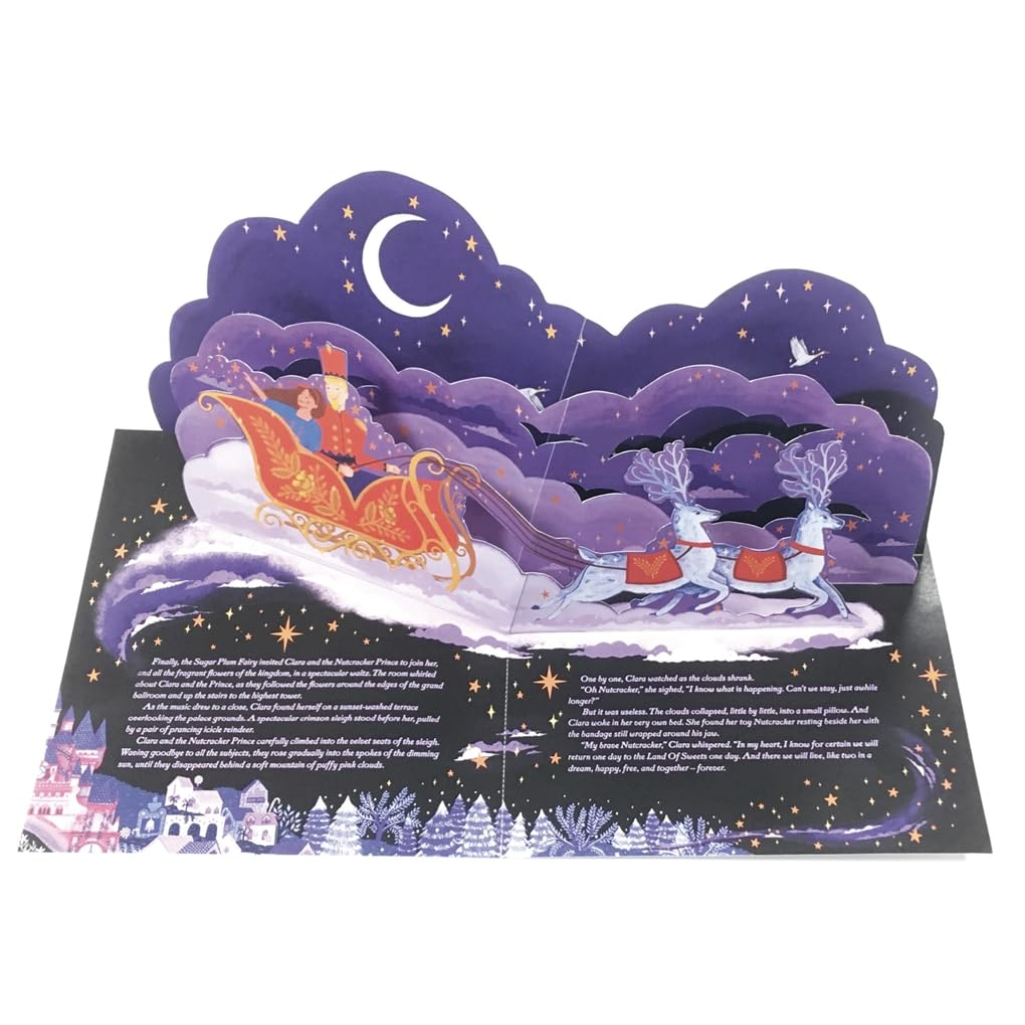 Pop-up card with a sleigh and reindeer design against a night sky.