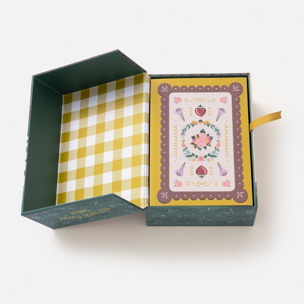 Open green box with a yellow checkered interior and a decorative card on a white background