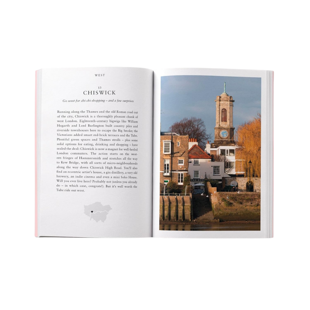 Open book with text and a photograph of a town scene on a white background
