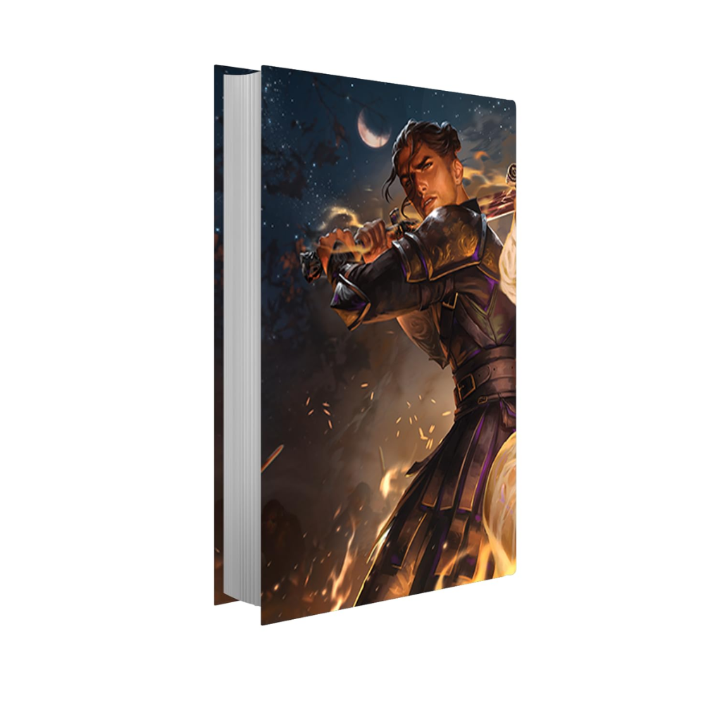 A hardcover book or notebook shown upright at a slight angle, featuring a fantasy illustration on the cover of a warrior character in dark armor with flames and a crescent moon in the background.