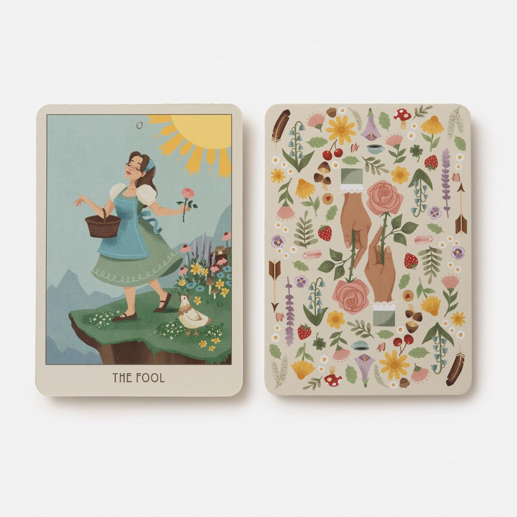 Two tarot cards with illustrations of a woman and nature elements on a white background