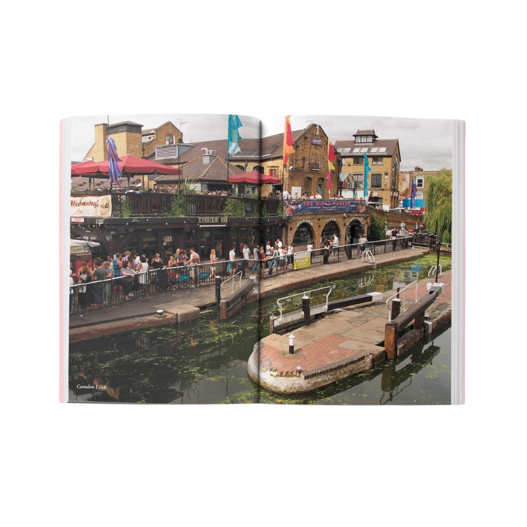 Canal-side scene with people and buildings in the background