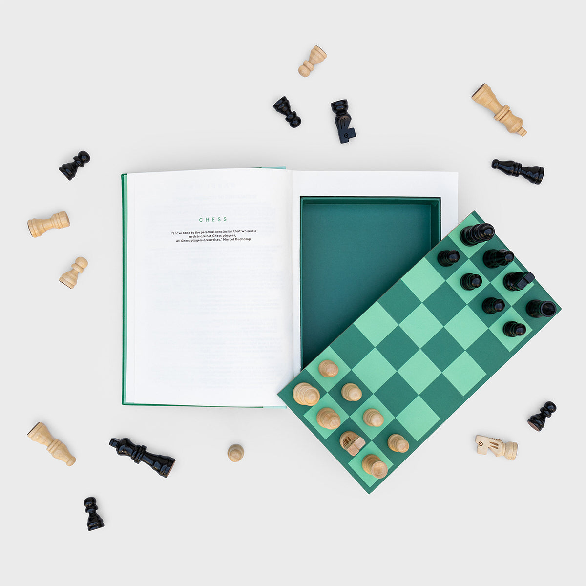 Chess in a Book: Contents of the box including a game board and pieces.