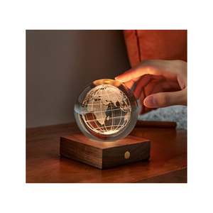 Glowing globe nightlight on a wooden base 