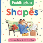 Book cover of 'Paddington Shapes' featuring Paddington Bear on a bench with colorful shapes.