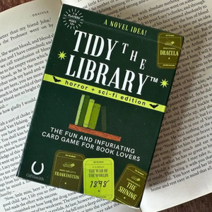 Card game packaging for 'Tidy the Library' on a book page