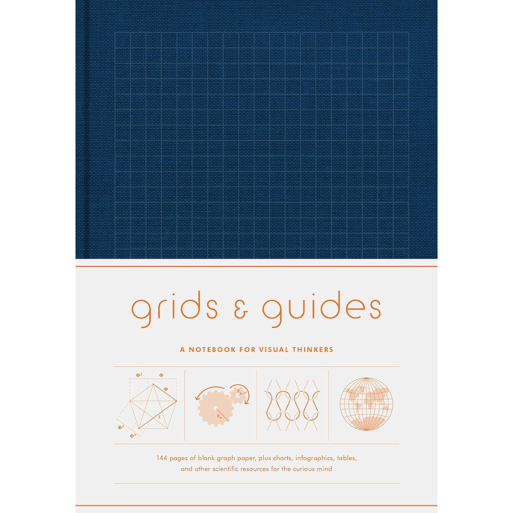 Notebook with grid design on cover and text 'grids & guides' on a white background