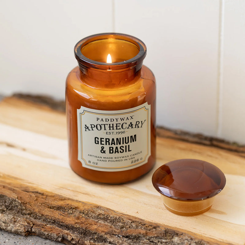 Geranium & Basil candle in an amber glass jar