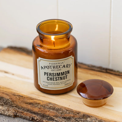 Persimmon and Chestnut Apothecary Candle, lit candle