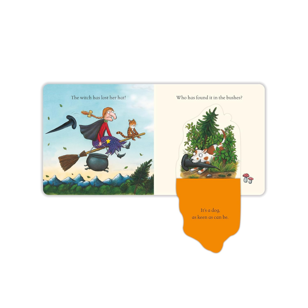 Illustrated book page with a witch on a broomstick and a dog in bushes, featuring text.
