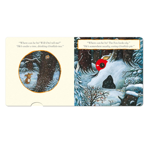 Illustrated book pages with winter scene and characters, featuring text and a pop-up element.