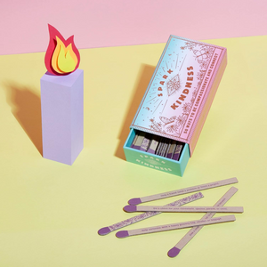 Matches with a box labeled 'Spark Kindness' on a colorful background