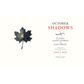 Book cover of 'October Shadows' with a black leaf on a white background