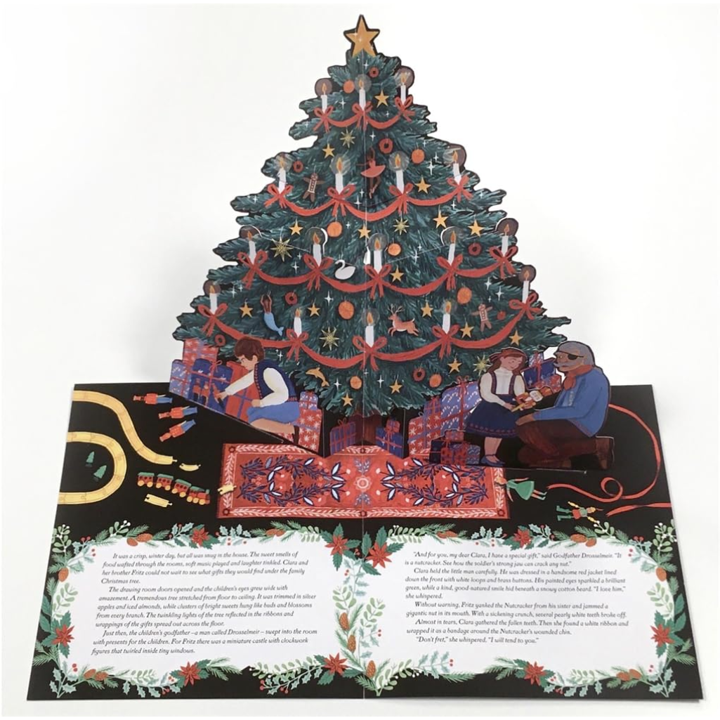 Pop-up Christmas tree card with detailed decorations and figures on a white background