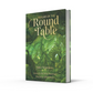 Book titled 'Realms of the Round Table' with green cover and gold text on a white background