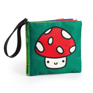 Children's book with a red mushroom design on a green cover