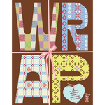 Cozy Wrapping Paper set featuring large letters spelling 'WRAP' filled with patchwork and patterned paper designs, tied with a pink ribbon and a light blue heart-shaped tag that reads '15 unique wrapping sheets, gift tags & stickers'.