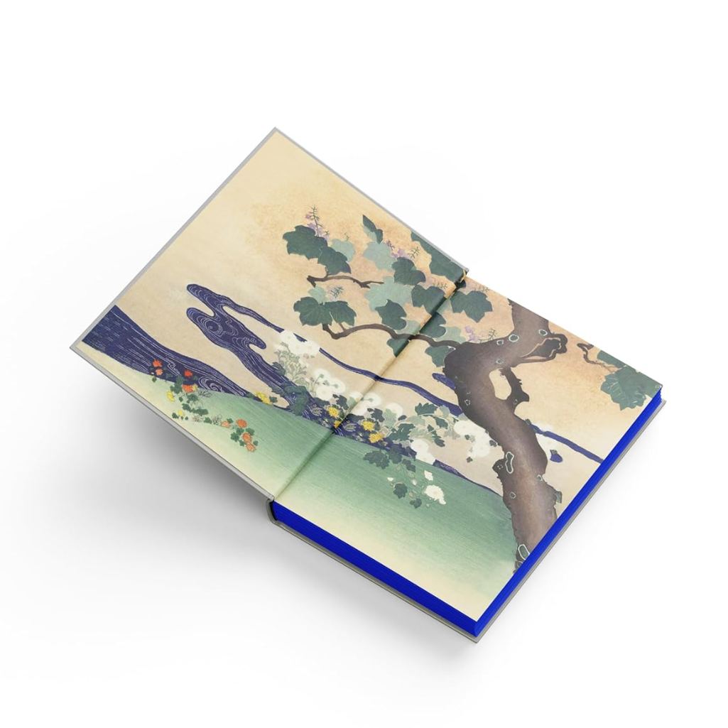 Notebook with a tree design on the cover against a white background