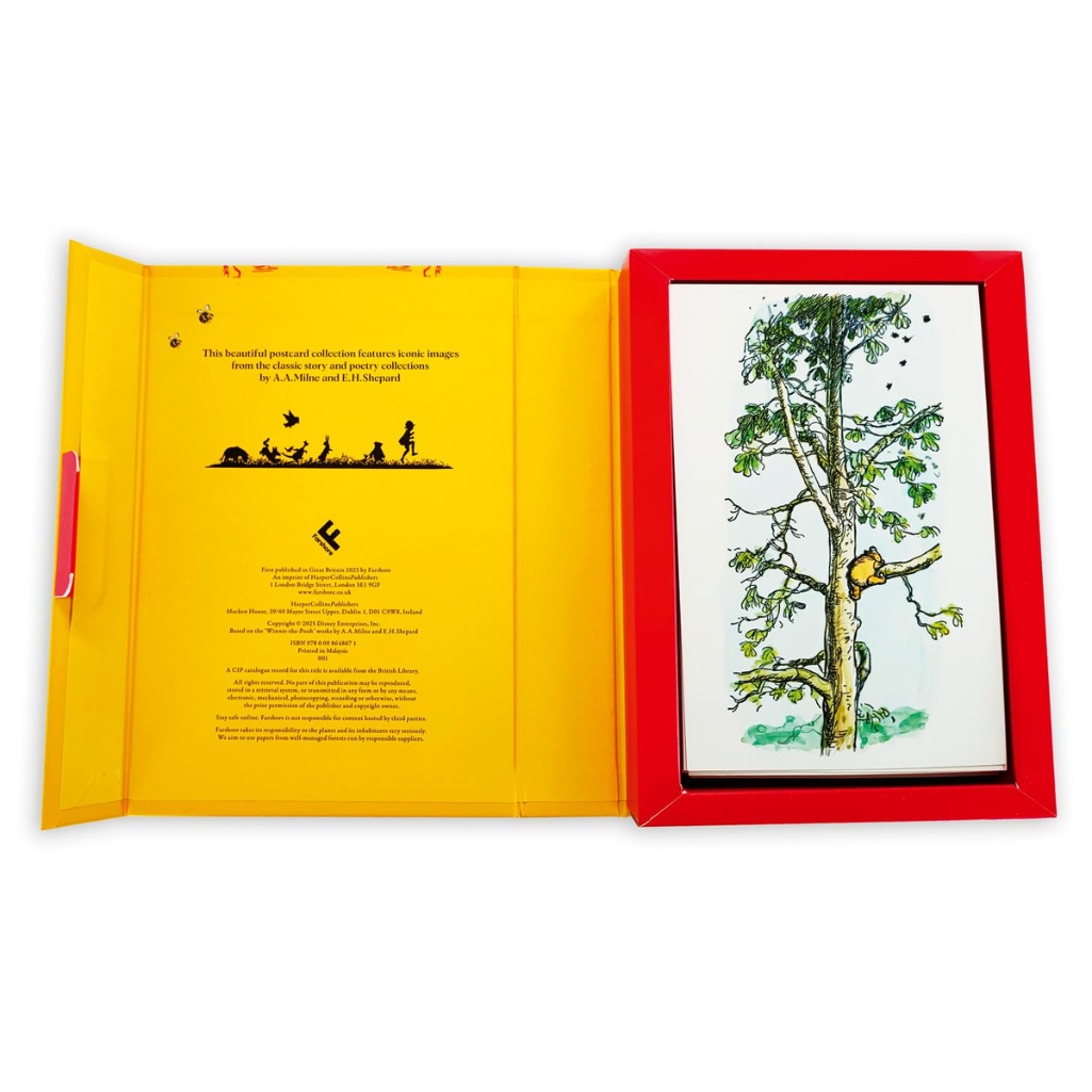 Open book with a yellow page and a red-framed illustration of a tree on a white background