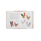 Open book with illustrations of chickens on a white background