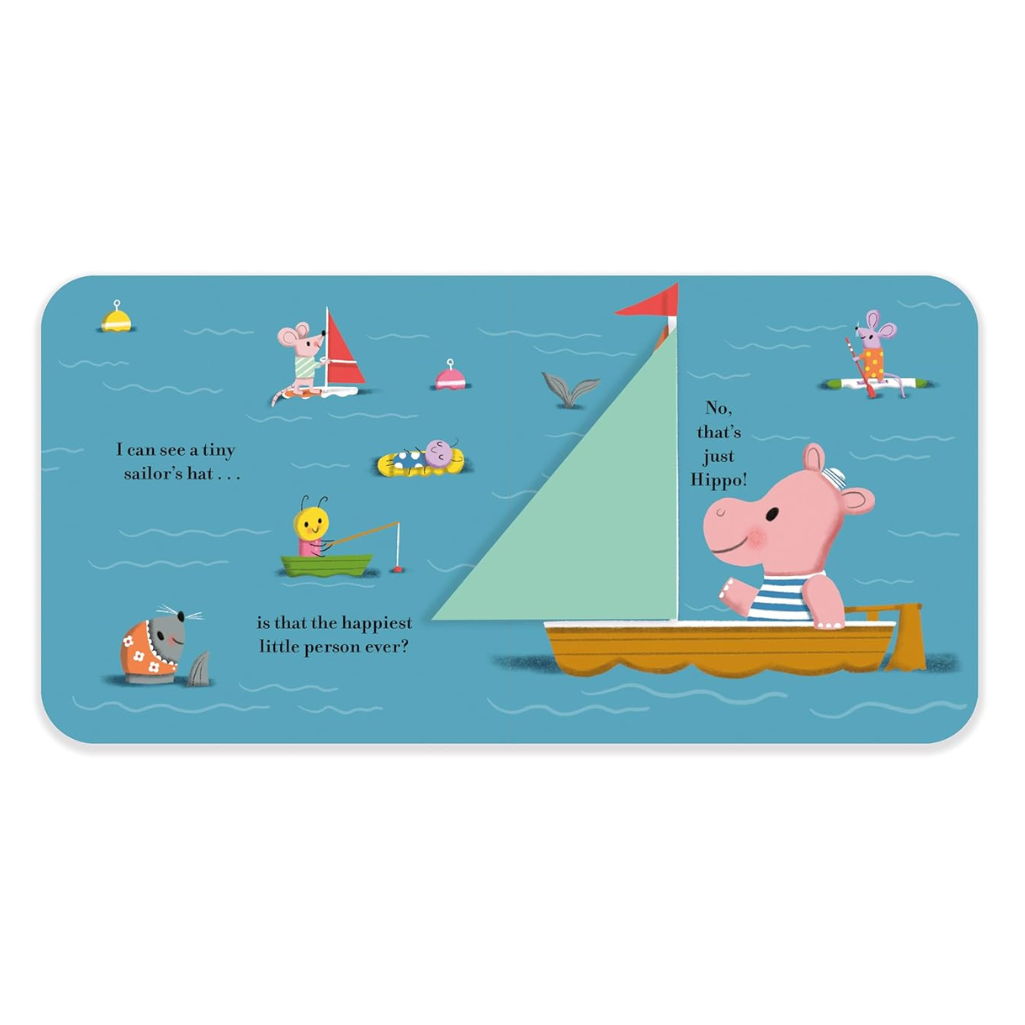 Illustrated book page with a pink hippo on a sailboat and various sea creatures.