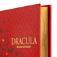 Red book titled 'Dracula' by Bram Stoker with a geometric pattern and bat illustrations on the cover.