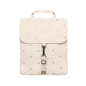An off-white backpack with a top handle, featuring a flap closure decorated with with Ecru Dots, a central black metal clip, and a small tan brand tag at the bottom.