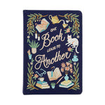Decorative notebook with embroidered designs and text on a white background
