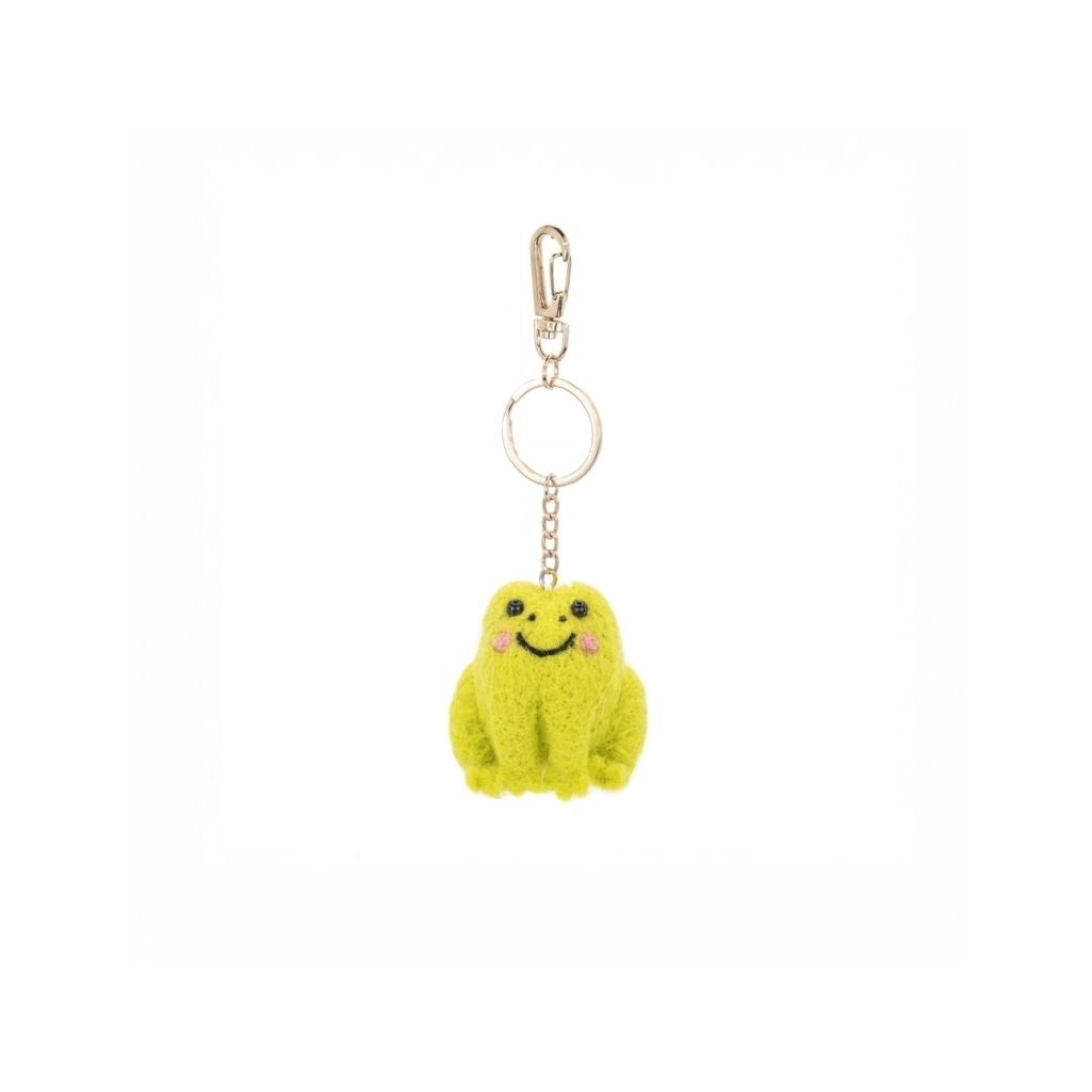 Green plush frog keychain with a smiley face on a white background