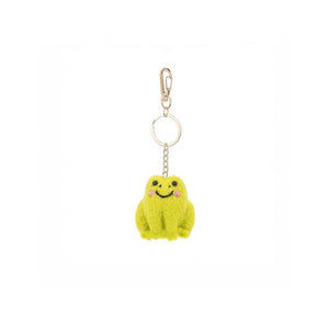 Green plush frog keychain with a smiley face on a white background