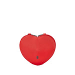 A bright red heart-shaped leather clutch bag with a small silver-toned logo plaque on the front, set against a light gray background.