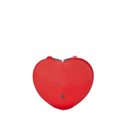 A bright red heart-shaped leather clutch bag with a small silver-toned logo plaque on the front, set against a light gray background.