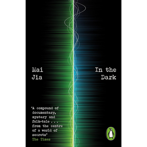 Book cover of 'In the Dark' by Mai Jia, featuring a black background with a vertical split of green and blue light streaks, white title and author text, a quote from The Times, and the Penguin logo.
