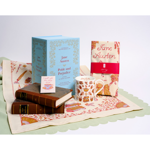 Collection of Jane Austen-themed items including pride and prejudice fascimile, a mug, teacup magnet, and a tea towel on a white background.