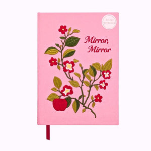 Pink notebook with floral design and 'Mirror, Mirror' text on a white background