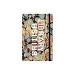A softcover notebook with a marbled endpaper cover pattern in beige, gray, orange, and black, featuring the words 'BRITISH LIBRARY' printed vertically in white.