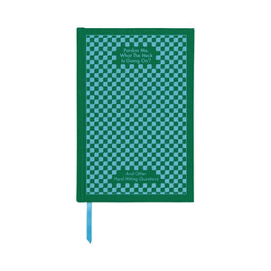 Green notebook with a checkered pattern on a white background