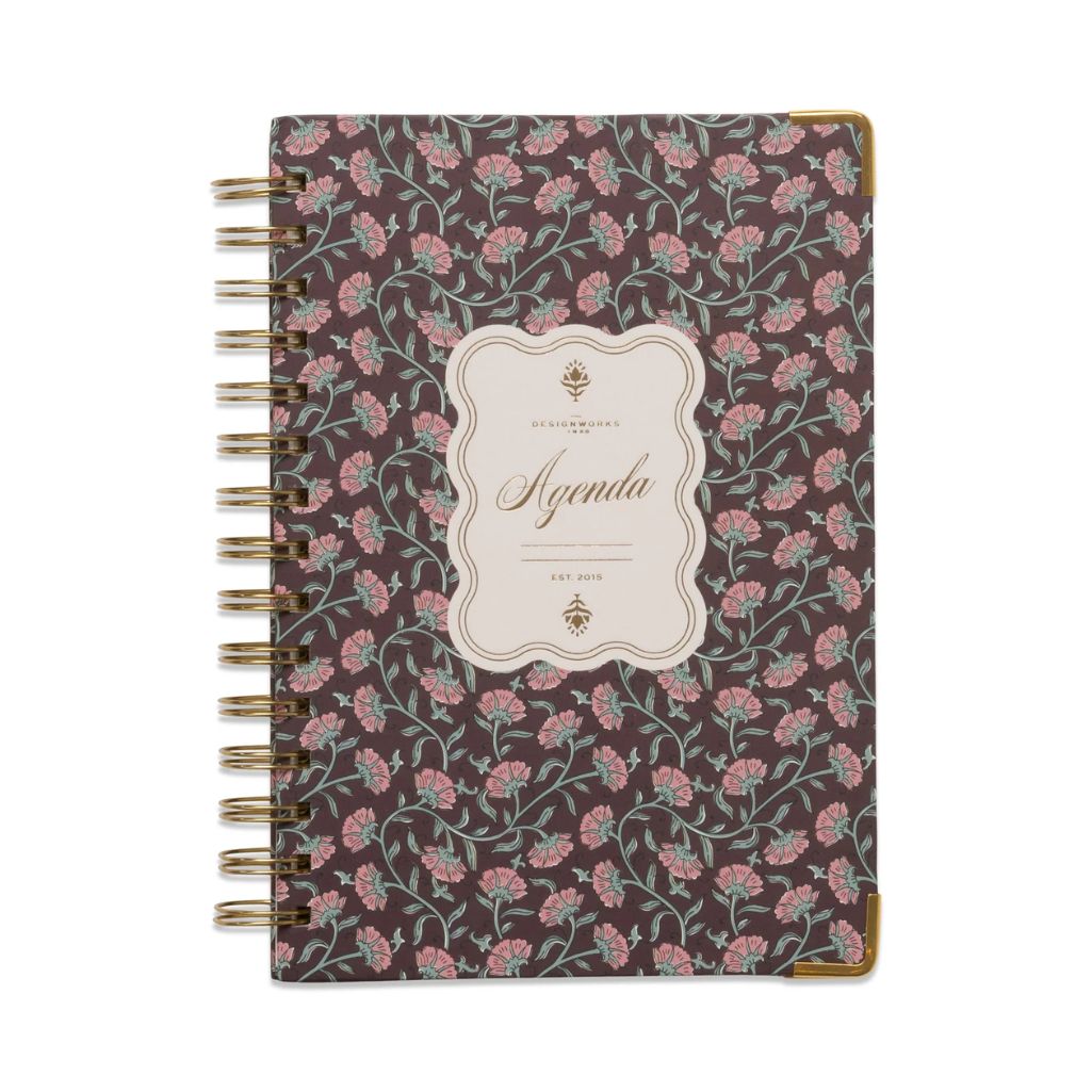 Floral patterned notebook with 'Agenda' label on a white background
